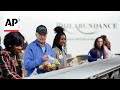 Biden volunteers at Philadelphia hunger relief organization on MLK Day