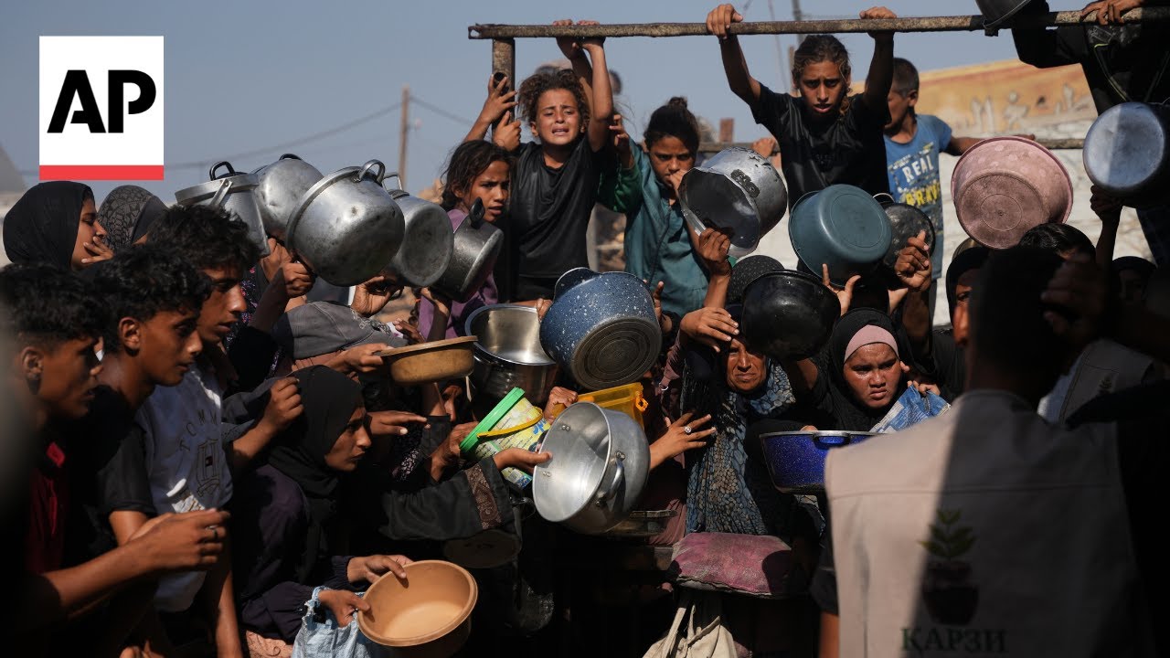 Women and children among desperate Palestinians trying to get food aid