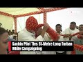 Sachin Pilot Congress | Sachin Pilot Ties 51-Metre Long Turban While Campaigning  - 01:11 min - News - Video