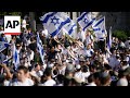 Israeli nationalists march through Palestinian area of Jerusalem, some chanting Death to Arabs