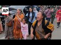 Rescuers run oxygen to survivors in Indonesia school building collapse that buried dozens
