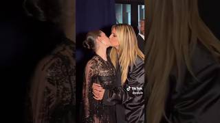 Heidi Klum and her daughter, Leni Klum, kiss on the lips.