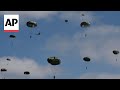 Parachutists recreate D-Day jumps from planes used in WWII operation to mark 80th anniversary