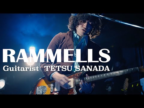 TETSU SANADA plays the guitar