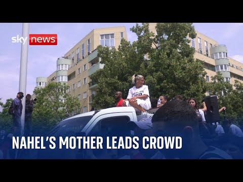 Mother of teenager killed by French police leads crowds through Nanterre