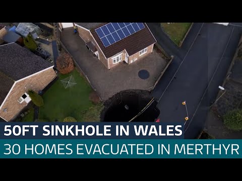 Huge 50ft sinkhole appears on Merthyr housing estate as homes evacuated| ITV News