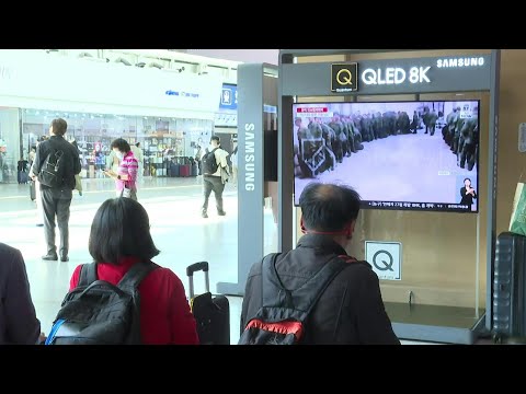 South Koreans watch news about North Korea at Seoul station | AFP