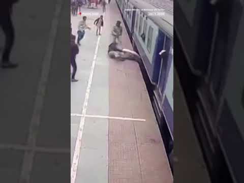 Watch: Railway officer #rescues man trapped under moving #train
