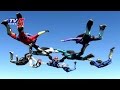 AMAZING group skydiving; 100 persons perform high up in air