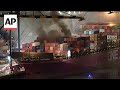 Dozens of firefighters battle blaze on container ship docked at LA port