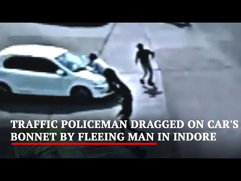 Man drags traffic police on car's bonnet for 4 km in Madhya Pradesh, CCTV footage Man drags traffic police on car's bonnet for 4 km in Madhya Pradesh, CCTV footage