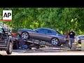 Authorities tow away Charlie Kirk shooting suspects vehicle from his home