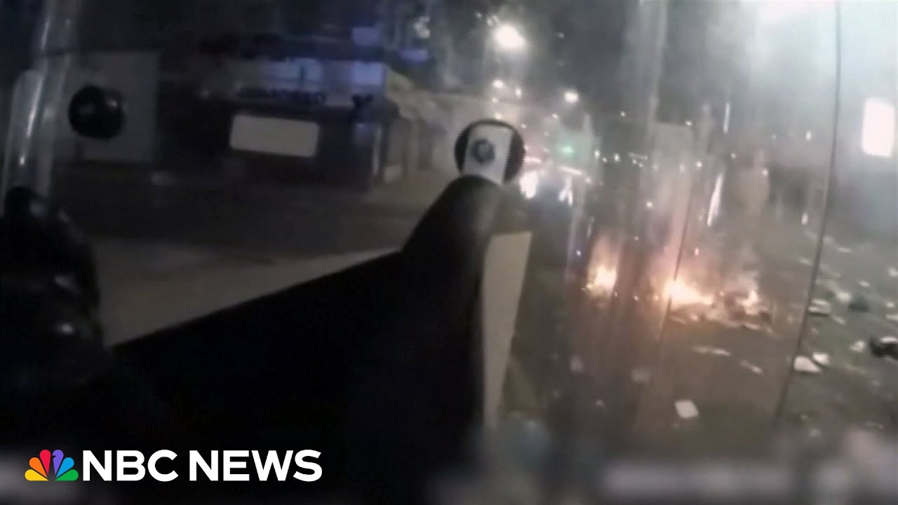 Bodycam footage shows U.K. police being pelted with fireworks during riots