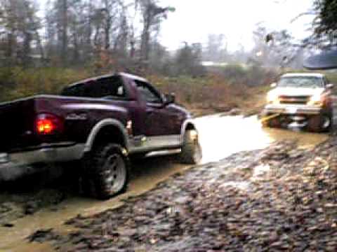 Chevy pulling ford out of mud #5