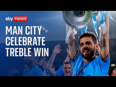 Manchester City players celebrate in Istanbul after treble win