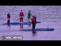 Santas trade sleighs for paddleboards to raise money for cancer