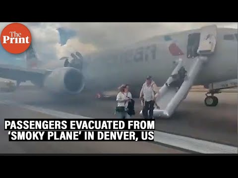 American Airlines passengers evacuated from smoky plane on Denver tarmac after landing gear issue