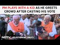 PM Modi In Ahmedabad | PM Modi Plays With A Kid As He Greets Crowd After Casting His Vote