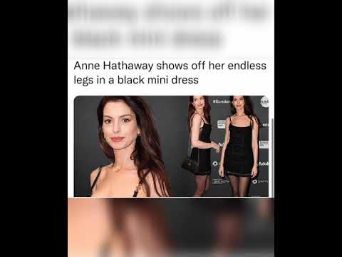 Anne Hathaway shows off her endless legs in a black mini dress