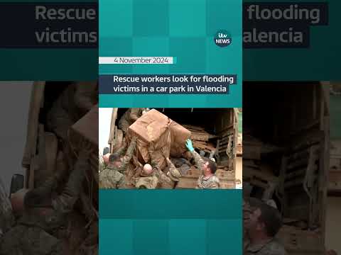 Rescue workers look for flooding victims in underground car park in Valencia #itvnews #shorts