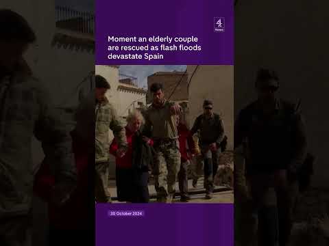 Moment an elderly couple are rescued as flash floods devastate Spain