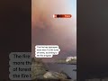 Smoke rises over the coast in southern France as wildfire rages on | REUTERS