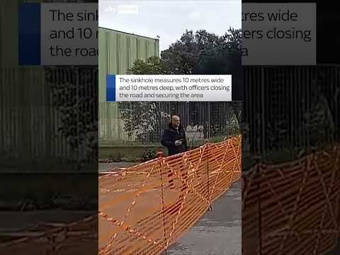 Large sinkhole swallows two cars