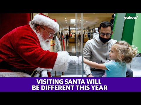 Santa takes precautions as visitors flock to see him amid the coronavirus pandemic