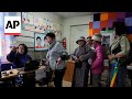 Voting underway in Mongolia, a landlocked democracy squeezed between China and Russia, AP explains