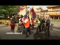 Anti-China protesters clash with police outside Chinese embassy during FM Wangs visit to Canberra  - 00:49 min - News - Video