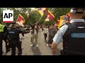 Anti-China protesters clash with police outside Chinese embassy during FM Wangs visit to Canberra