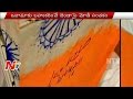 Modi signs National Flag, sparks Controversy