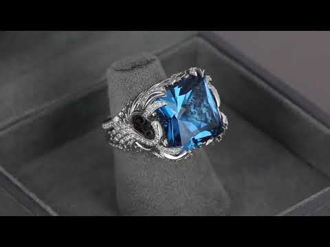 Женский перстень из белого золота с топазом и бриллиантами