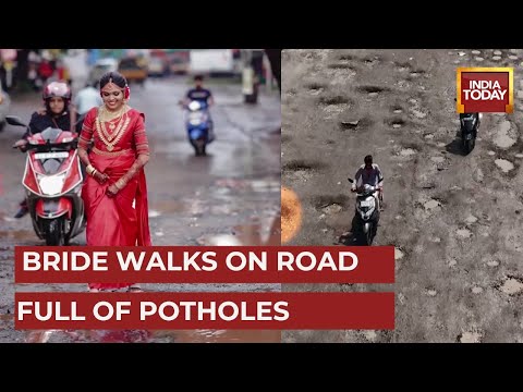 Bride walks on road full of potholes for wedding photoshoot, wins netizens' hearts Bride walks on road full of potholes for wedding photoshoot, wins netizens' hearts