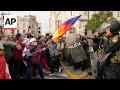 Police crack down on young demonstrators marching in Peru capital