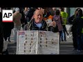 People line up to buy tickets for Spains Christmas lottery