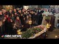 Roses, tears and a solemn goodbye: Mourners honor the memory of Alexei Navalny