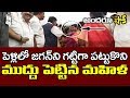 Woman hugs and kisses Jagan in a marriage event