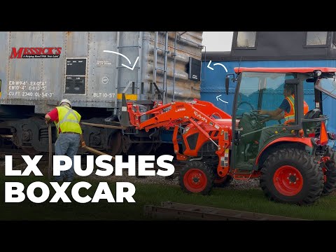 Kubota Pushing a Boxcar at The Red Caboose Motel | Kubota's and Coffee Picture
