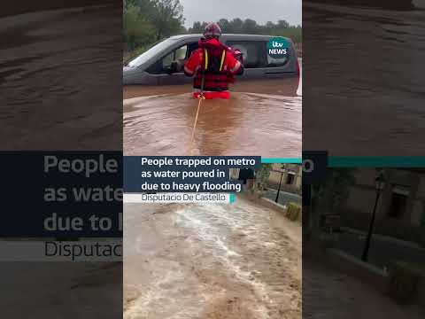 People trapped on metro as water poured in due to heavy flooding #itvnews #spain #madrid #flood