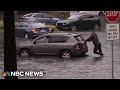 WATCH: NBC reporter pushes car out of water as severe flooding hits South Florida