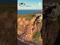 Luxury homes teeter on cliff edge after landslide - ABC News
