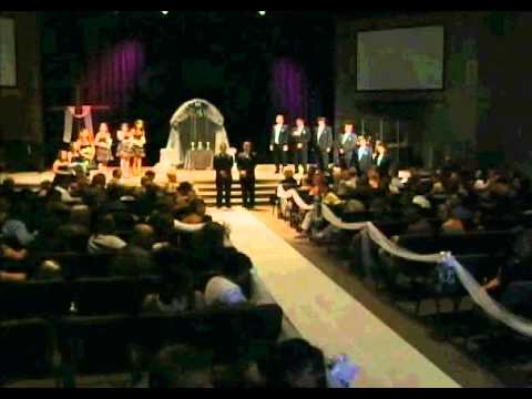 Bride shocks groom as she sings to him walking down the aisle.