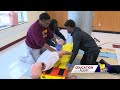 Dunbar High School students take up life-saving skills in class
