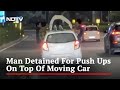 Man performs push-ups on moving car in Gurugram
