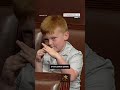 Congressmans son pulls funny faces behind dad during House floor speech