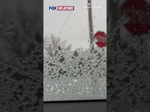 Sleet Piles Up On Car Windshield During Severe Storm In Michigan