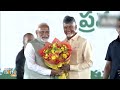 Vijayawada: CM N Chandrababu Naidu Hugs PM Modi Before Swearing-In | News9  - 03:23 min - News - Video