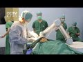 Watch: China-developed robot helps with transformative Parkinson's surgery