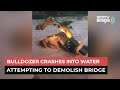 Video: Bulldozer Crashes Into Water Attempting to Demolish A Bridge in UP